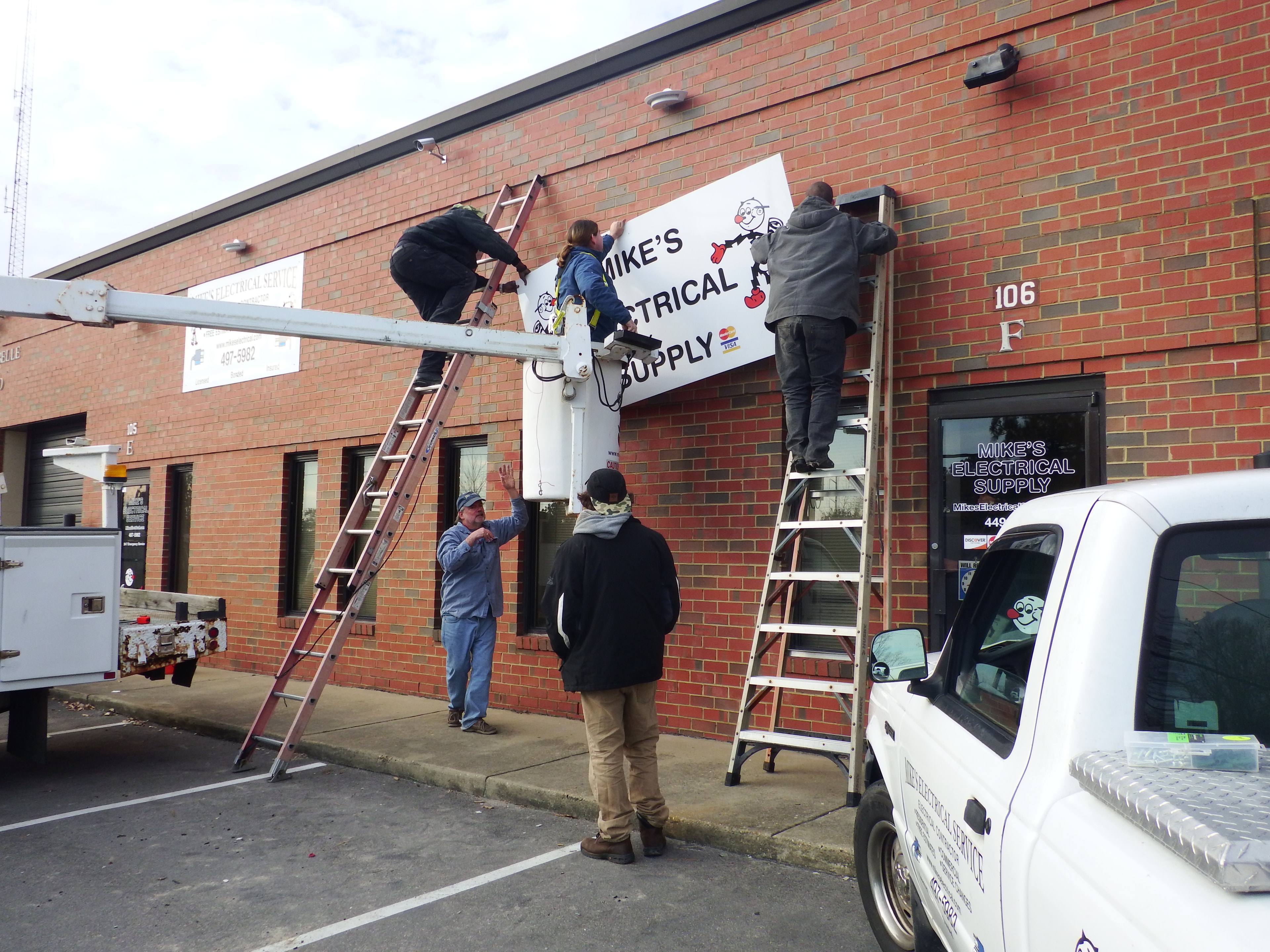 Mike's Electrical crew performing commercial sign lighting installation — Hampton Roads
